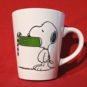 Peanuts 2019 Snoopy Holding A Candy Cane With His Dish. White Christmas Holiday